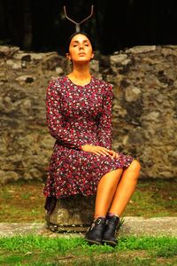 Portrait of woman sitting outdoors