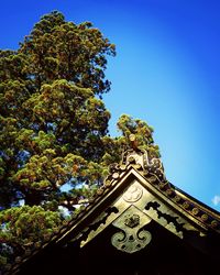 Low angle view of built structure against clear blue sky