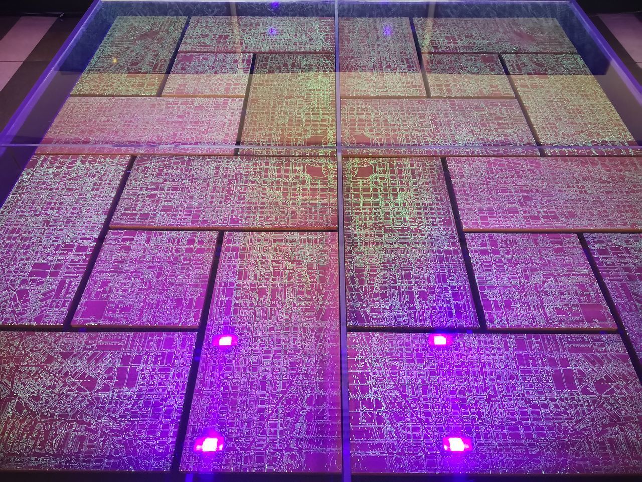 HIGH ANGLE VIEW OF ILLUMINATED LIGHTS ON TILED FLOOR