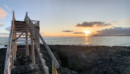 Scenic view of sea against sky during sunset on isabela island galapagos 