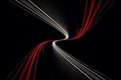 Light trails in illuminated tunnel