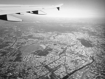 Cropped image of airplane flying over landscape