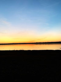 Scenic view of beach against sky during sunset