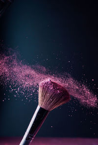 Close-up of water splashing against black background