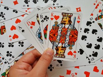 Close-up of hand playing on table