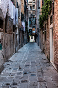 Footpath amidst buildings in historical city center 