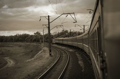 View of railway tracks against cloudy sky