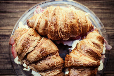 Close-up of croissants served in plate on table