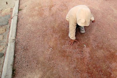 High angle view of man standing on footpath