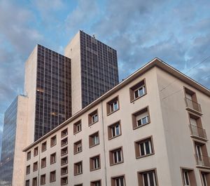 Low angle view of modern buildings against sky