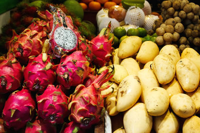 Fruit market in thailand, exotic street food, mango and dragon fruit