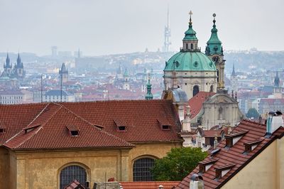 Buildings in city against sky