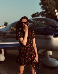 Woman standing by air vehicle