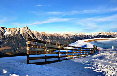 Scenic view of snow covered mountains against sky