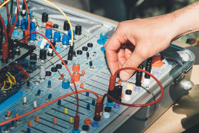 Close-up of man using sound mixer