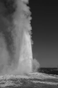 Scenic view of ole faithful geyser in yellowstone.