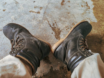 Low section of person wearing shoes standing outdoors