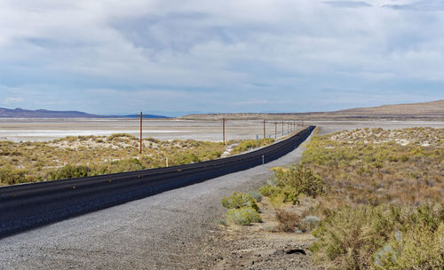 Road by land against sky
