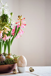 Easter composition from hyacinths flowers and quail eggs on linen tablecloth. zero waste easter.