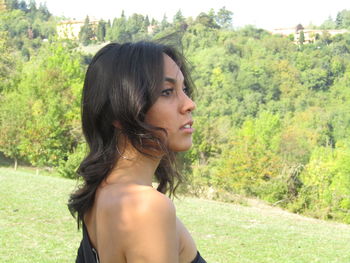 Portrait of beautiful young woman looking away