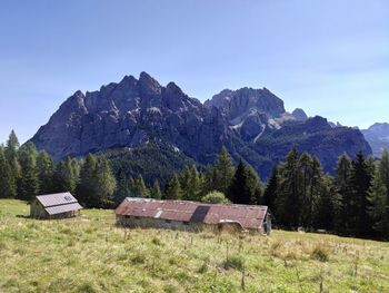Built structure on field against sky