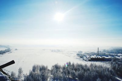 Panoramic view of snow covered landscape against sky