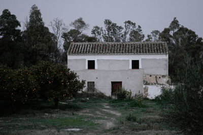 House on field against sky