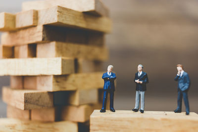 Men standing on wood