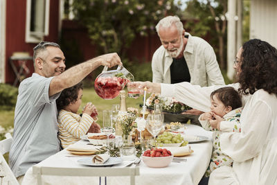 Family having meal in garden