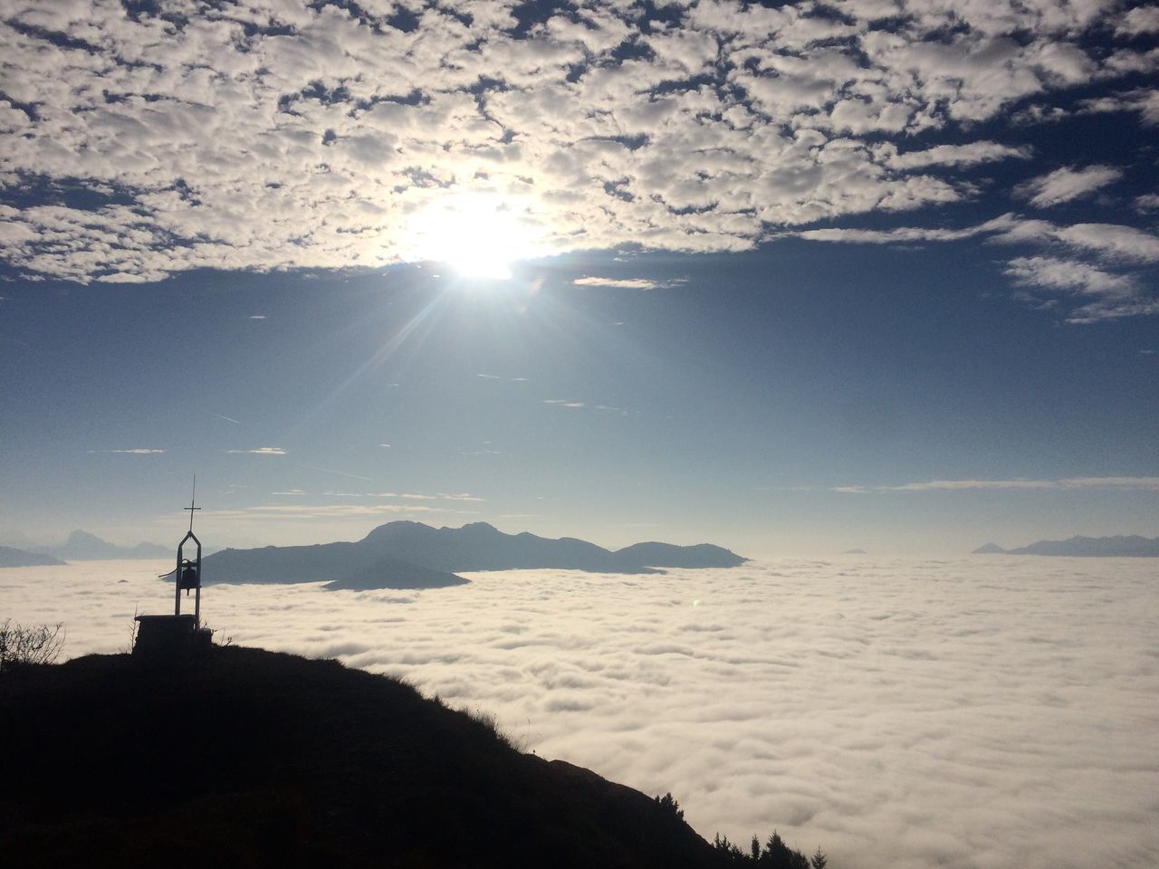 sky, sunlight, sun, water, beauty in nature, scenics - nature, nature, cloud - sky, mountain, sea, sunbeam, tranquil scene, land, no people, tranquility, silhouette, sunny, lens flare, outdoors, bright