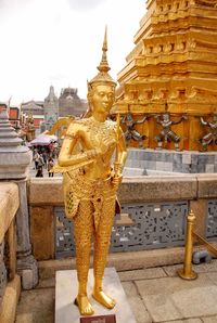 Statue of temple outside building