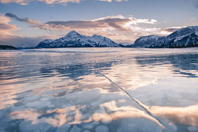 Frozen methane bubbles and reflected sky at abraham lake, alberta