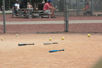 Baseball bats and balls on land