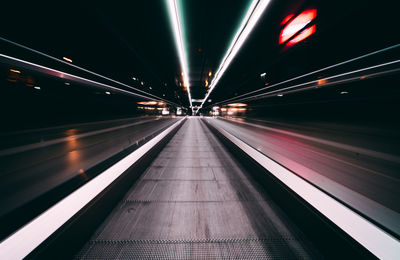 Blurred motion of illuminated subway station