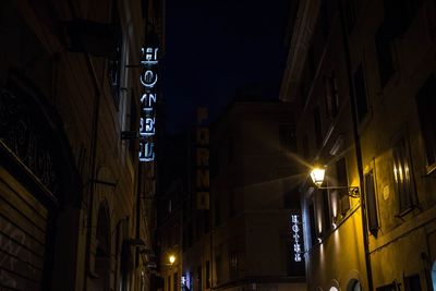 Low angle view of illuminated building at night