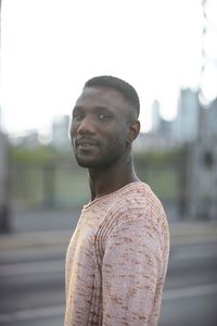 Portrait of young man standing outdoors