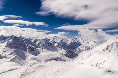 Scenic view of snowcapped mountains against sky