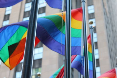 Multi colored flags on pole