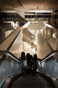 People standing on escalator