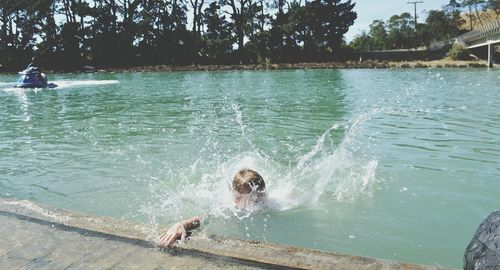 Person swimming in river