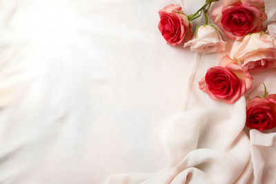 Midsection of bride holding bouquet