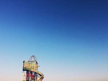 Low angle view of building against clear blue sky
