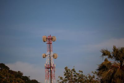 Low angle view of communications tower against sky