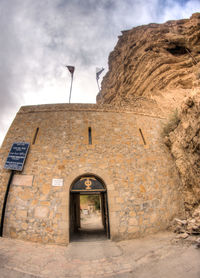 Entrance of historic building against sky