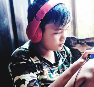 Close-up portrait of cute boy looking at camera