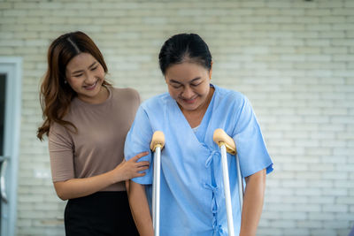 Female friends using mobile phone