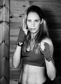 Portrait of confident kickboxing athlete at gym