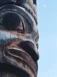 Low angle view of sculpture against sky