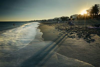 Scenic view of sea against clear sky during sunset