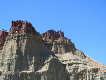 Scenic view of mountains against clear blue sky